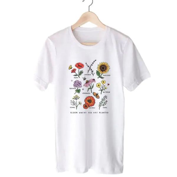Women's Short Sleeve T-Shirt featuring a floral print design with vibrant colors on a white background.