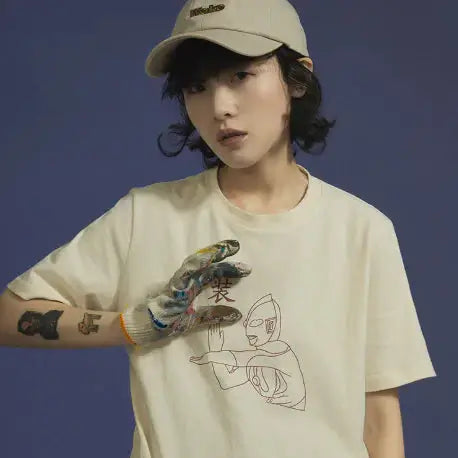 Short Sleeve T-Shirt for women featuring a relaxed fit and unique graphic design in beige color.