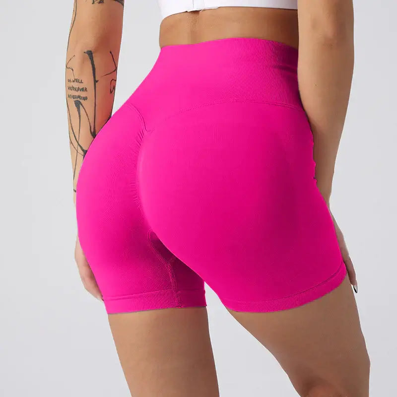 Women Yoga Shorts in vibrant pink, showcasing the back design for comfort and style during workouts.