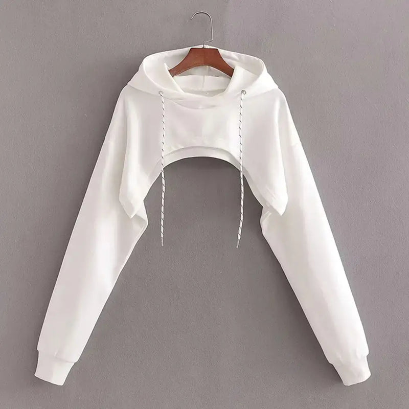 Chic Cropped Hoodie Blissful hanging on a wooden hanger against a gray background, showcasing its stylish design.