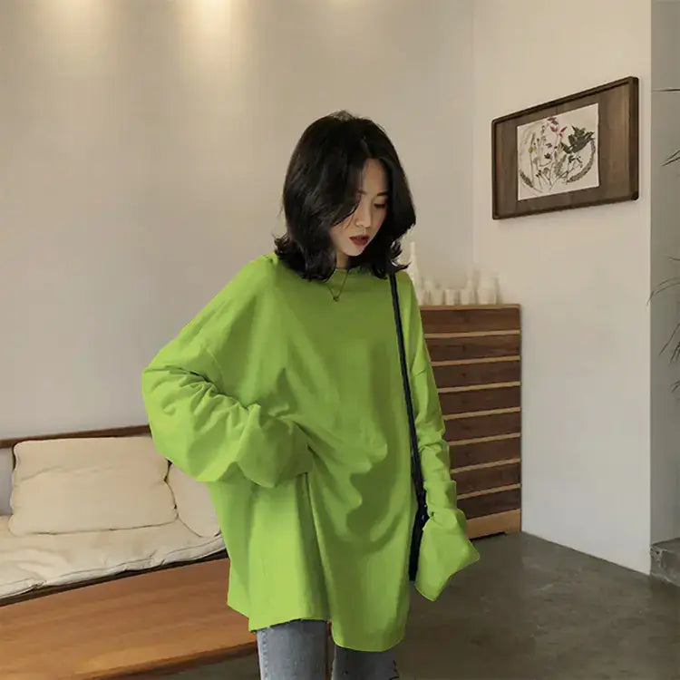 Chic Long Sleeve T-Shirt-Loose Fit Style in vibrant green, perfect for a casual, stylish look indoors.