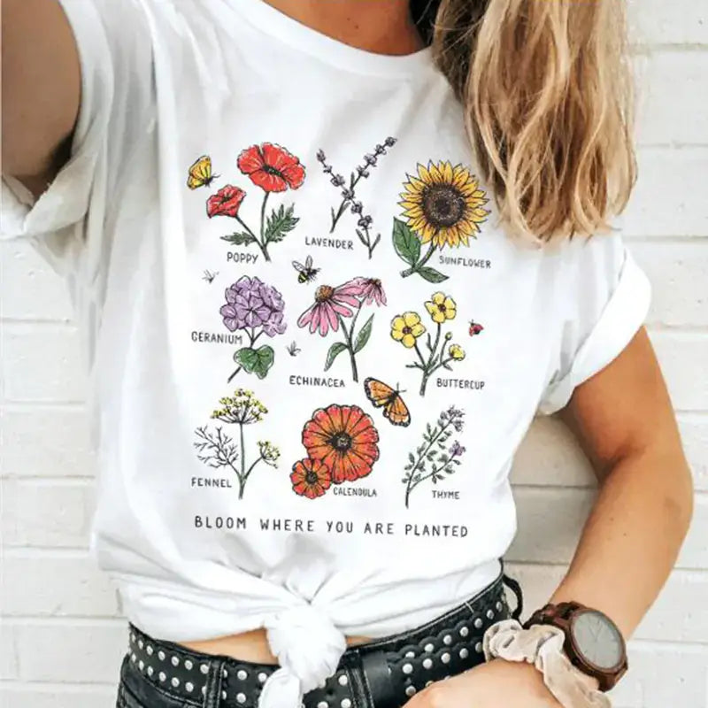 Women's Short Sleeve T-Shirt featuring vibrant flower prints and a trendy design.