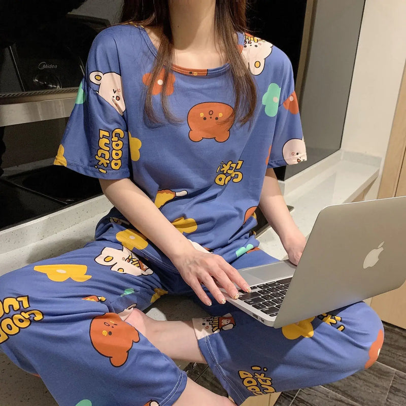 Fashion Cartoon Pajamas for Women in cozy blue fabric, featuring playful cartoon characters, perfect for lounging.