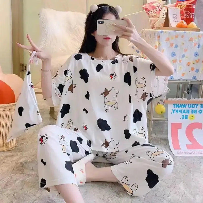 Fashion Cartoon Pajamas for Women featuring playful cow prints, perfect for casual lounging at home.