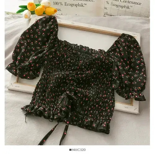 Floral Ruffled Tops for Women - Elegant Chic Crop Top in black with stylish puff sleeves and floral pattern.