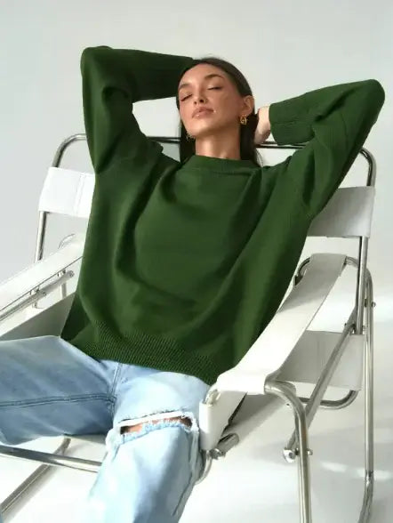 Loose Crew Neck Sweatshirt for Women worn by a model relaxing in a chair, showcasing its cozy fit.