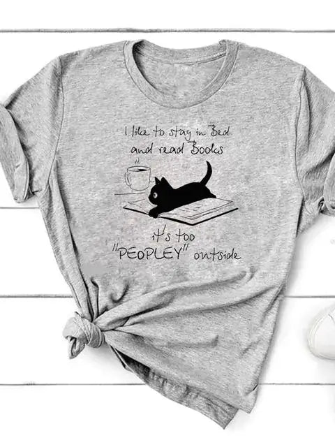 Short Sleeve T-Shirt for Women with cat graphic and quote about staying in bed and reading books.