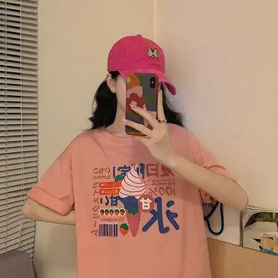 Short Sleeve Women's T-Shirt in pink with ice cream graphic, styled with a pink cap.
