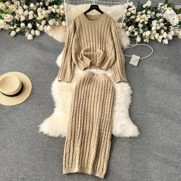 Stylish Knitted Comfort Set featuring a cozy sweater and skirt in a chic twist-knit pattern.