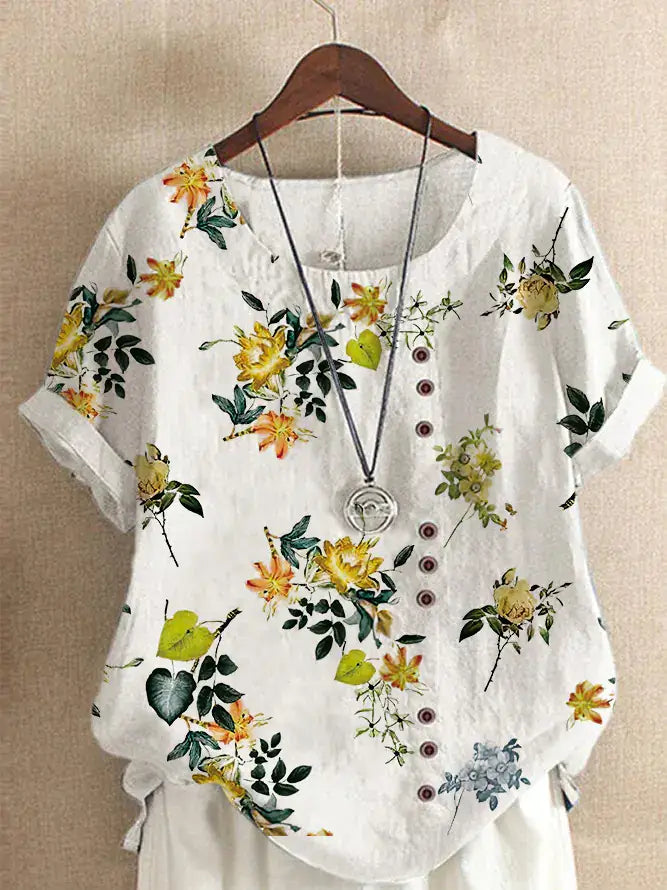 Summer Vintage Cotton Linen Loose T-Shirt featuring floral print and button details on a hangar.