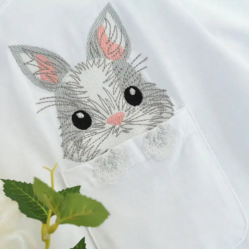 Embroidered rabbit design on a Short Sleeve T-Shirt for Women, showcasing playful and chic fashion.