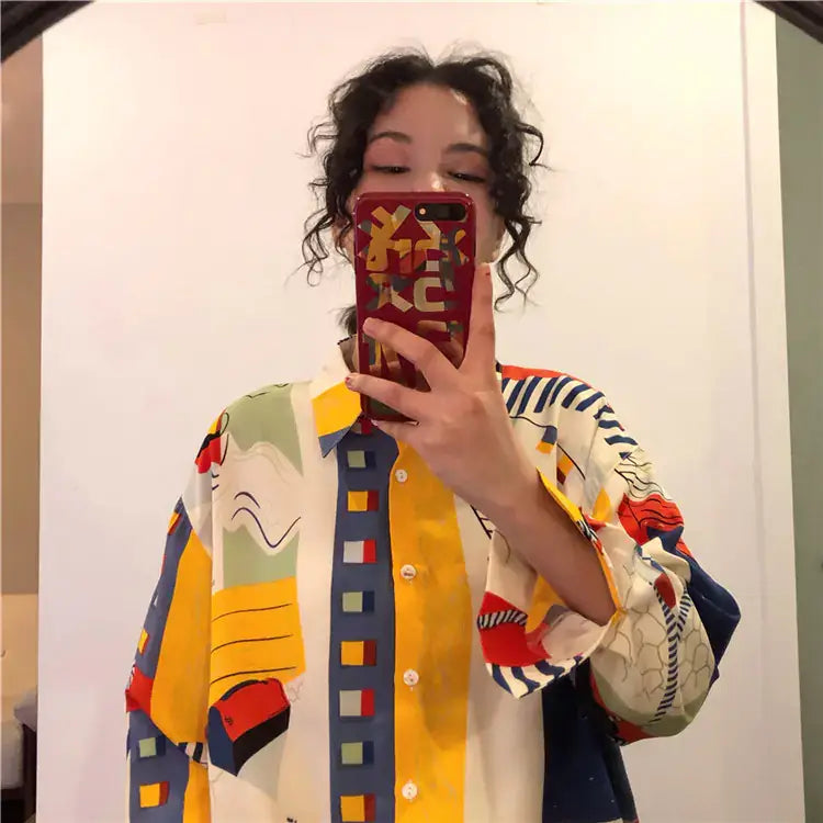 Vintage French Style Long Sleeve Shirt worn by a woman with abstract print design, capturing a retro chic aesthetic.