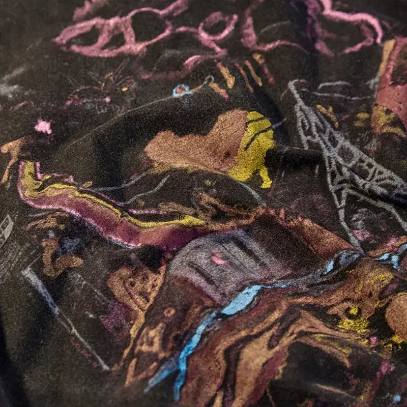 Vintage Street Style Loose Graphic T-Shirt close-up showing colorful graphic design on black fabric.