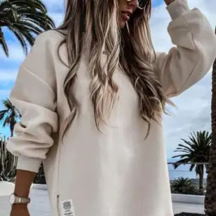 Winter Sweatshirt Dress for Women worn by a model against a palm tree backdrop.