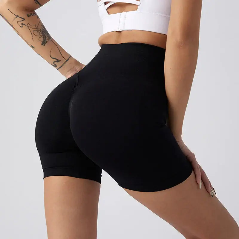 Women Yoga Shorts showcasing a sleek design in black, ideal for comfort and flexibility during workouts.