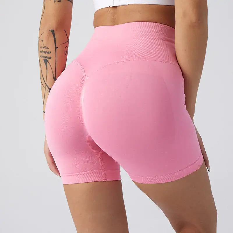 Women Yoga Shorts in pink, showcasing a comfortable and stylish fit for active women, perfect for workouts.