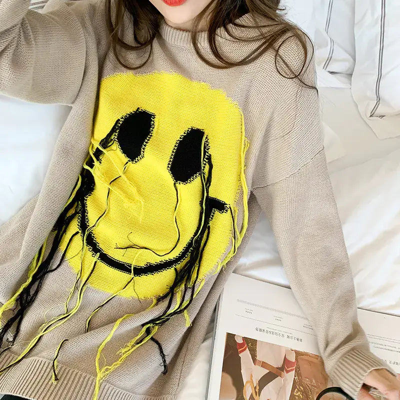 Women's Blissful Smile Pattern Sweater showcasing a vibrant smiley face design in a cozy style.
