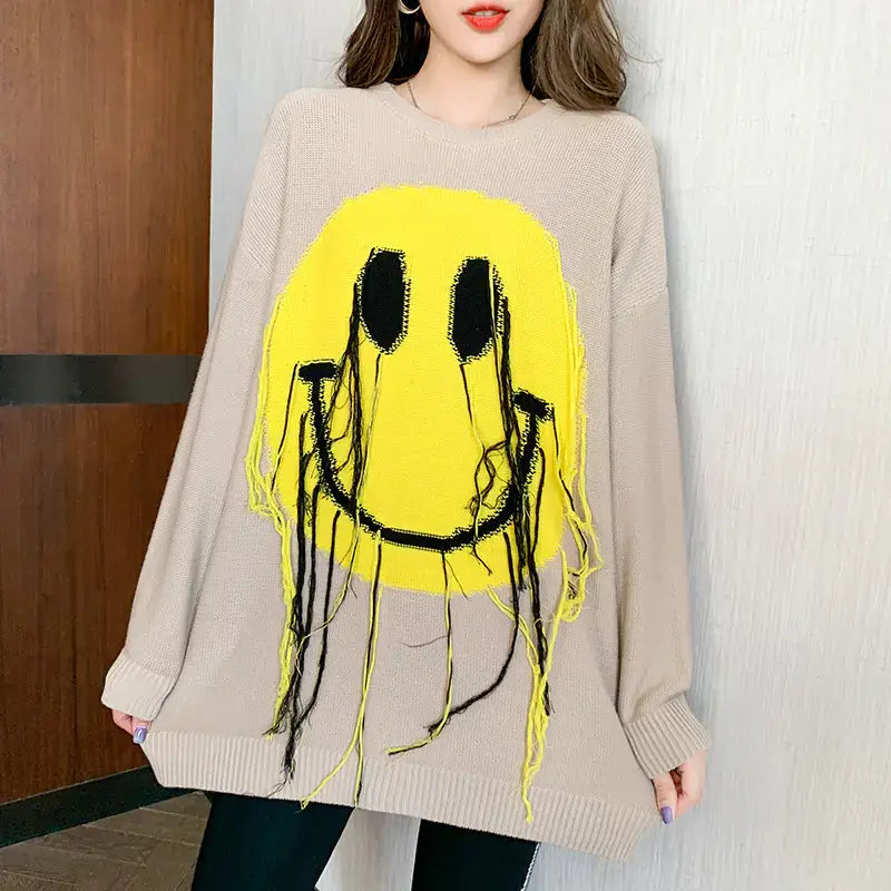 Women's Blissful Smile Pattern Sweater featuring a vibrant smiley face design on a cozy fabric.
