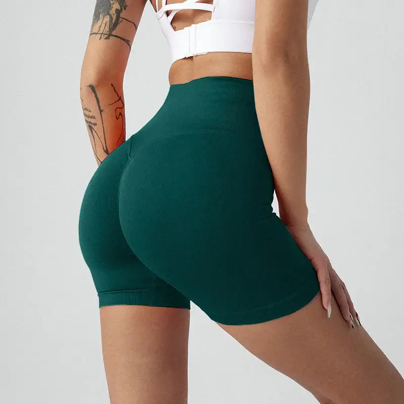 Women Yoga Shorts, breathable green nylon shorts designed for comfort and style in yoga or everyday wear.